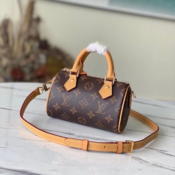 Louis Vuitton . Handbags - Monogram Mini Barrel Crossbody Bag in Brown with Tan Trim
